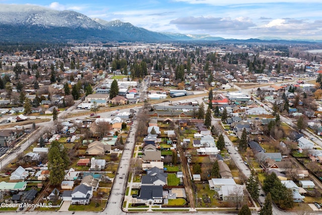 birds eye view of property with a mountain view