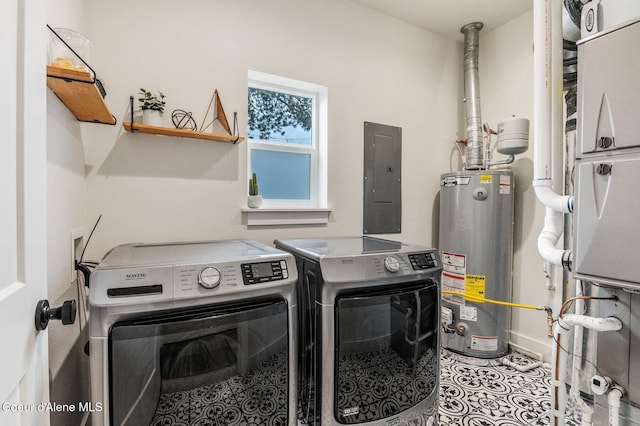 laundry area with electric panel, water heater, washer and clothes dryer, and light tile patterned flooring