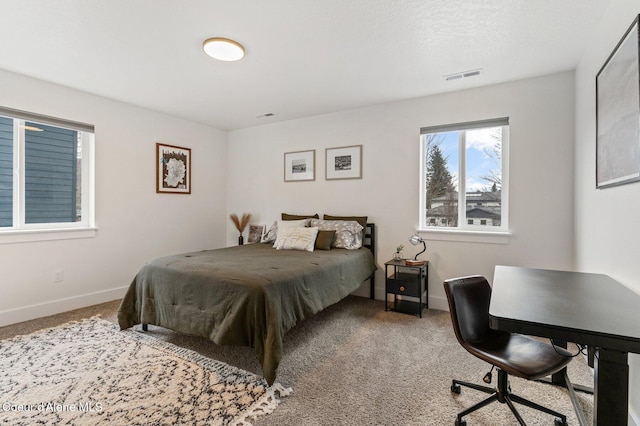 bedroom featuring carpet