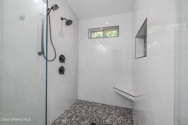 bathroom featuring tiled shower