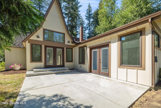 back of property with a patio and french doors