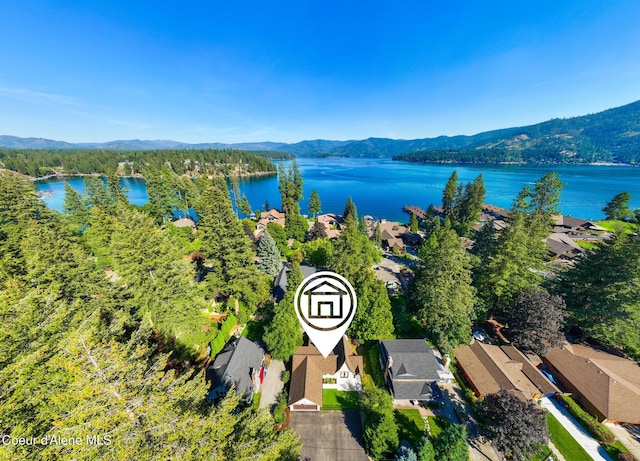 aerial view featuring a water and mountain view