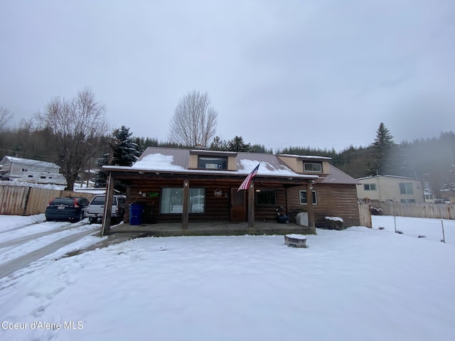 cabin featuring covered porch