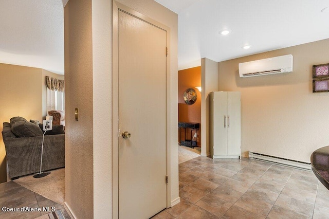 corridor featuring an AC wall unit and a baseboard radiator