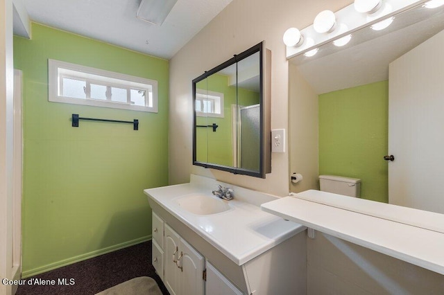 bathroom with toilet and vanity