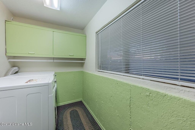 laundry area featuring cabinets and washing machine and dryer