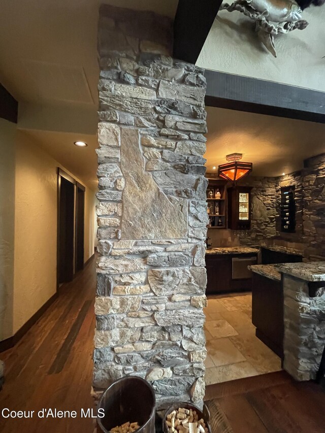 bar with hardwood / wood-style flooring