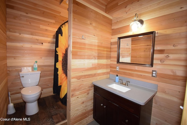 4333 Old Highway Two Loop, Moyie Springs, ID 83845 - full bath with vanity, wood walls, and curtained shower
