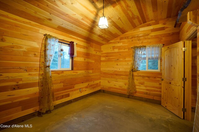 4333 Old Highway Two Loop, Moyie Springs, ID 83845 - spare room featuring lofted ceiling, unfinished concrete floors, wood walls, and wood ceiling