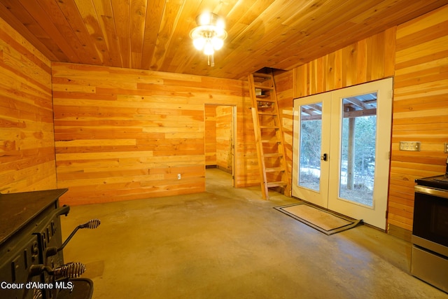 4333 Old Highway Two Loop, Moyie Springs, ID 83845 - interior space with french doors, wooden walls, concrete floors, and wood ceiling