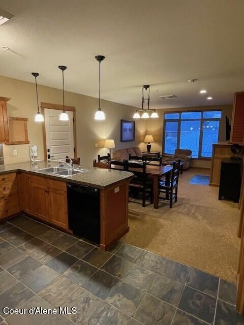 kitchen featuring kitchen peninsula, sink, hanging light fixtures, and black dishwasher