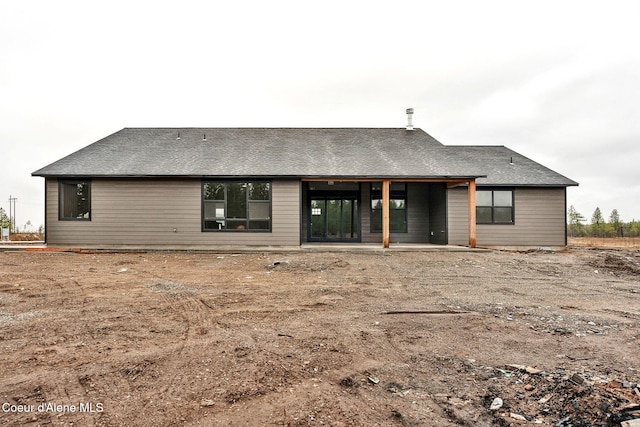 back of property with a patio