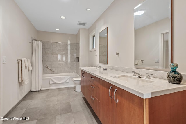 full bathroom featuring toilet, vanity, and shower / tub combo with curtain