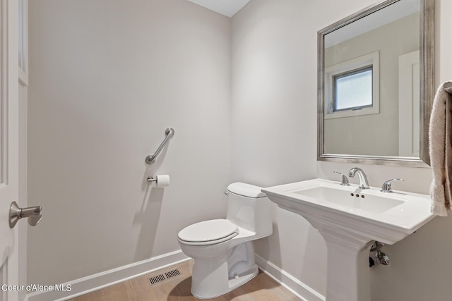 bathroom with toilet and sink