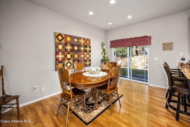 dining space with light wood finished floors, recessed lighting, and baseboards