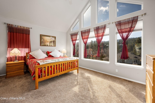 carpeted bedroom featuring visible vents, baseboards, and high vaulted ceiling