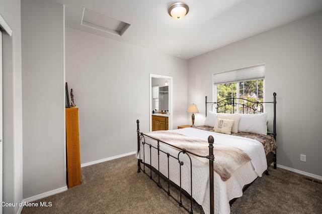 bedroom featuring baseboards, carpet floors, attic access, and visible vents