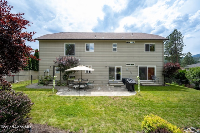 back of property featuring a fenced backyard, a patio area, entry steps, and a yard