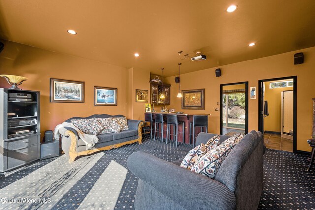 carpeted living room featuring recessed lighting and indoor wet bar