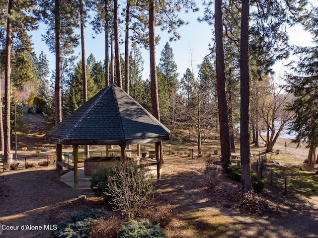 surrounding community featuring a gazebo and fence