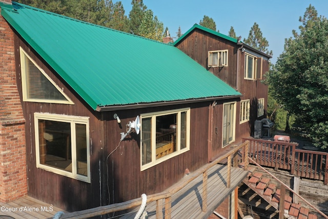 view of side of property featuring a deck