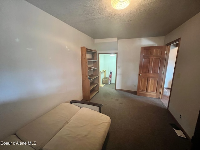 carpeted bedroom with a textured ceiling