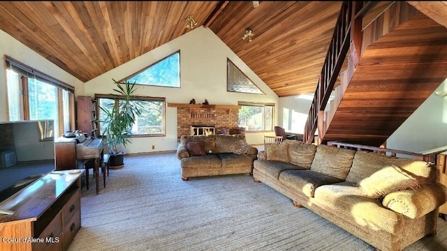 carpeted living room featuring wooden ceiling, high vaulted ceiling, and a fireplace