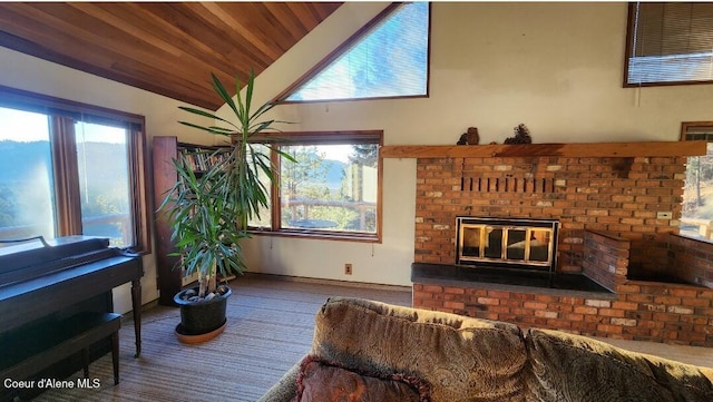 living room featuring a brick fireplace and vaulted ceiling