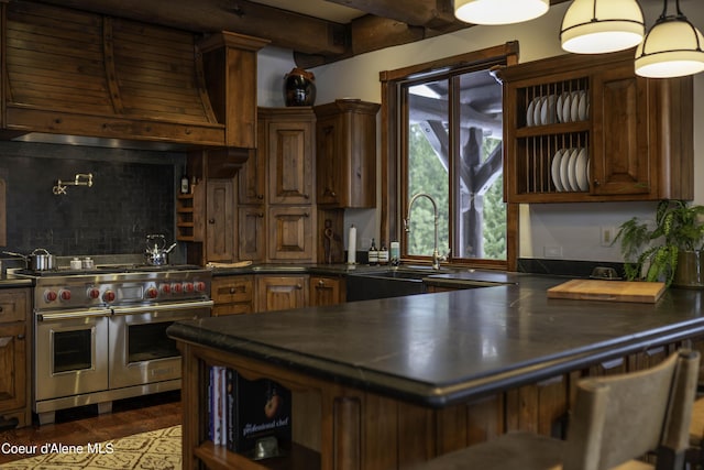 16692 S Lazurite Dr, Coeur Dalene, ID 83814 - kitchen featuring double oven range, sink, decorative backsplash, beam ceiling, and kitchen peninsula