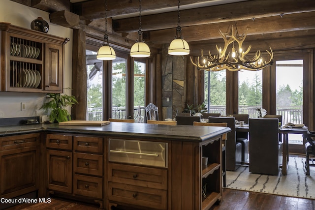16692 S Lazurite Dr, Coeur Dalene, ID 83814 - kitchen featuring beamed ceiling, decorative light fixtures, dark hardwood / wood-style flooring, and a chandelier