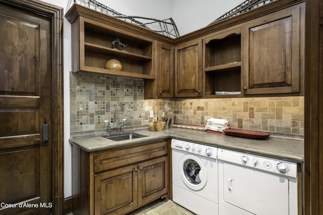 16692 S Lazurite Dr, Coeur Dalene, ID 83814 - laundry room featuring washer and clothes dryer, sink, and cabinets
