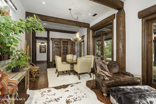 16692 S Lazurite Dr, Coeur Dalene, ID 83814 - dining area with a notable chandelier and dark wood-type flooring