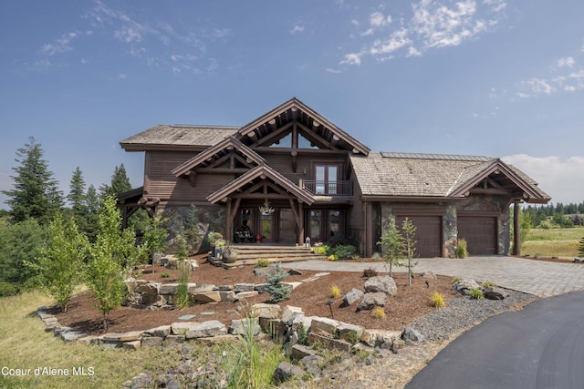 16692 S Lazurite Dr, Coeur Dalene, ID 83814 - view of front of home featuring a garage, a balcony, and french doors