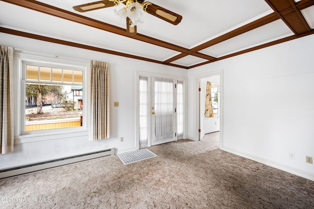 foyer entrance with baseboard heating, ceiling fan, carpet flooring, and a healthy amount of sunlight