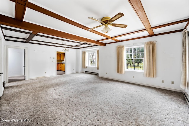 empty room featuring carpet floors, a wealth of natural light, beamed ceiling, and coffered ceiling