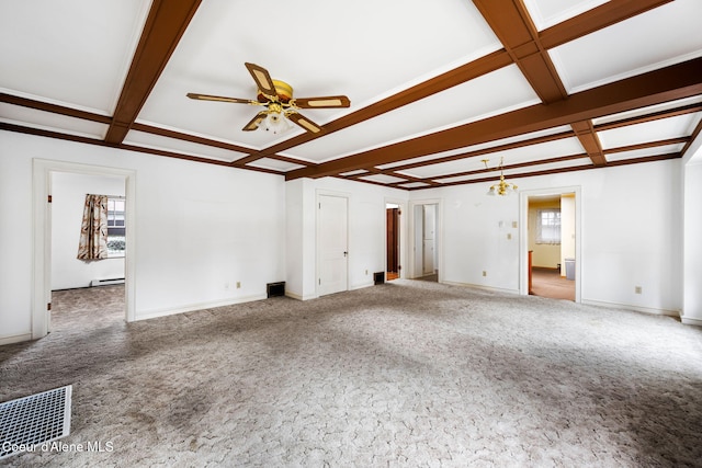 unfurnished living room with beam ceiling, a wealth of natural light, and coffered ceiling