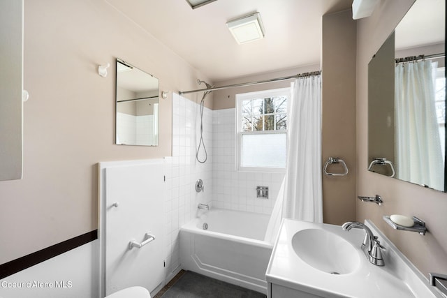 bathroom featuring vanity and shower / bath combination with curtain