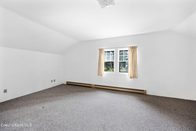 additional living space featuring carpet floors, a baseboard radiator, and vaulted ceiling