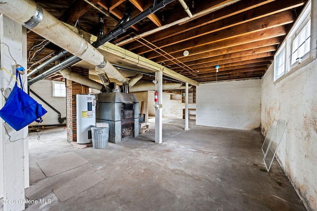 basement with electric water heater and plenty of natural light