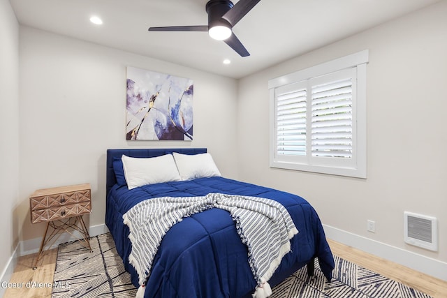 bedroom featuring hardwood / wood-style floors and ceiling fan