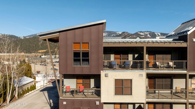 snow covered property with a mountain view