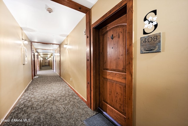 hallway with carpet floors