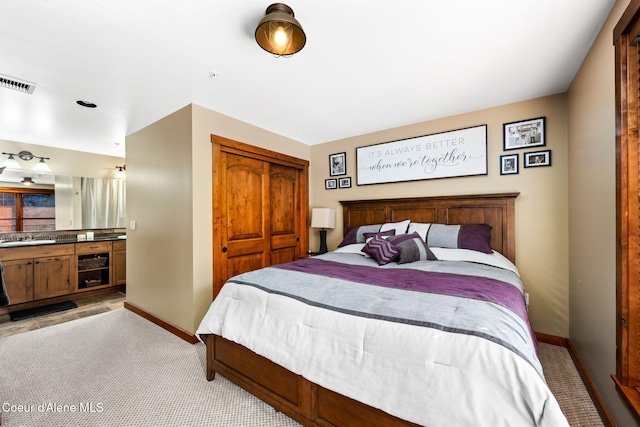 carpeted bedroom featuring a closet