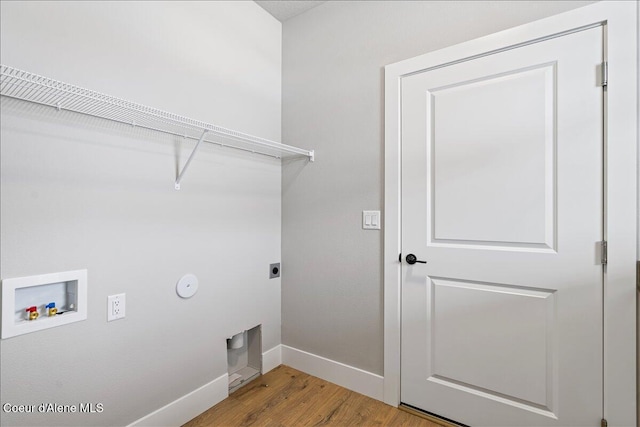 laundry room with washer hookup, electric dryer hookup, light hardwood / wood-style floors, and hookup for a gas dryer