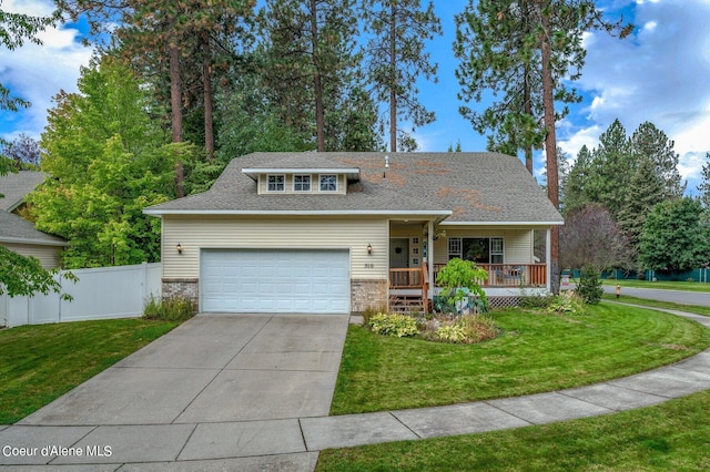 view of front of home with a front lawn, a porch, and a garage