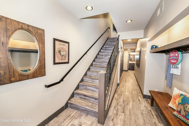 staircase featuring hardwood / wood-style floors