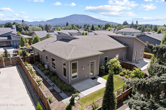 birds eye view of property with a mountain view