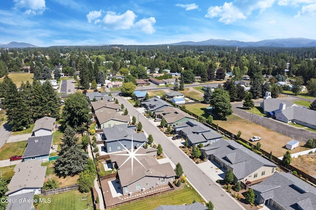 birds eye view of property with a mountain view