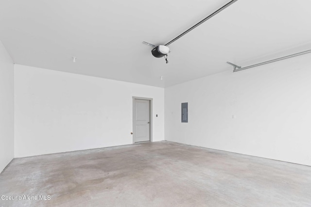 garage with electric panel and a garage door opener