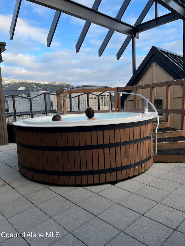 view of patio / terrace with a hot tub